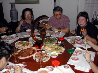 Mom & Dad at dinner with friends and relations
